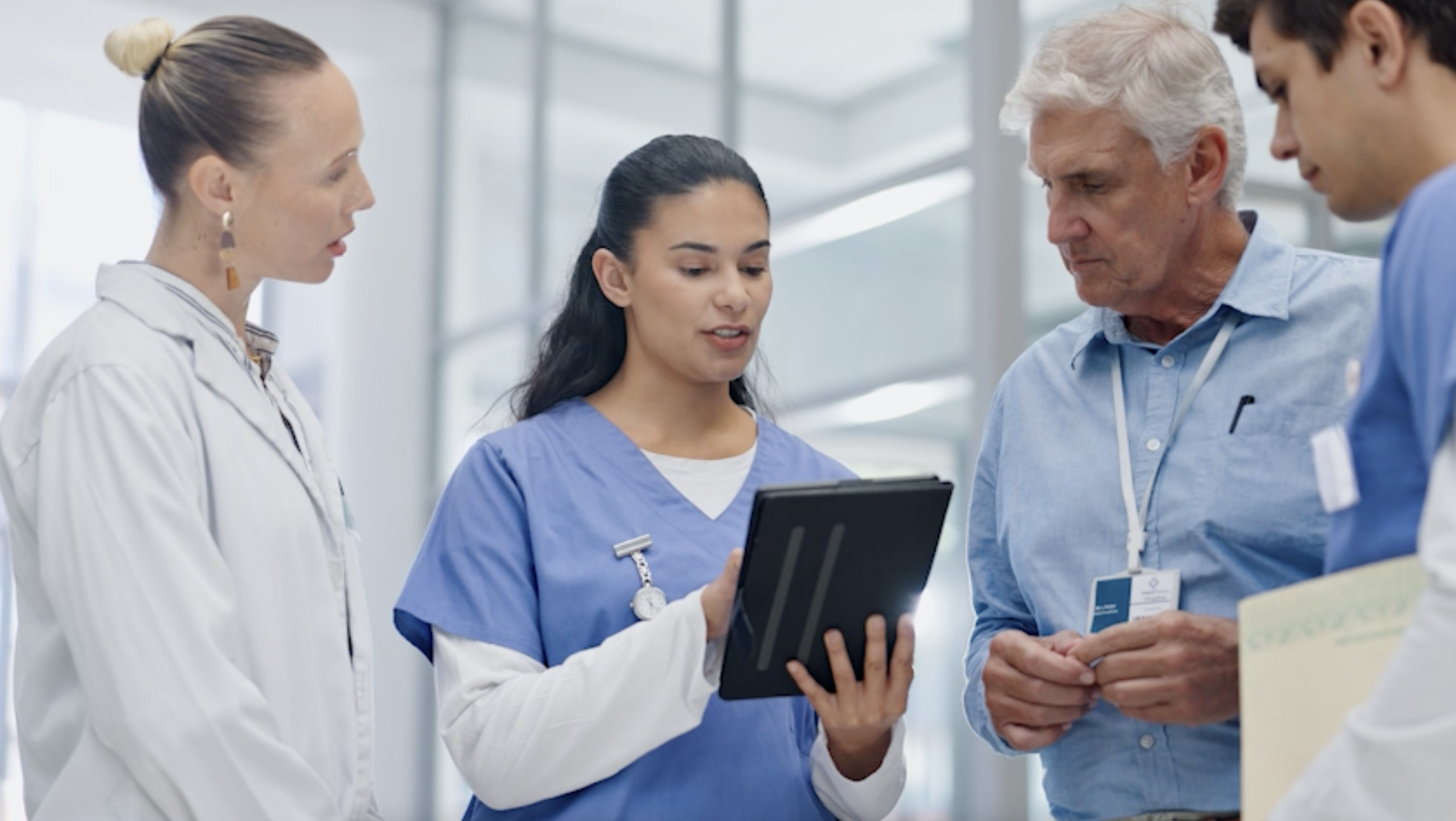Healthcare professionals in discussion during a team care planning meeting