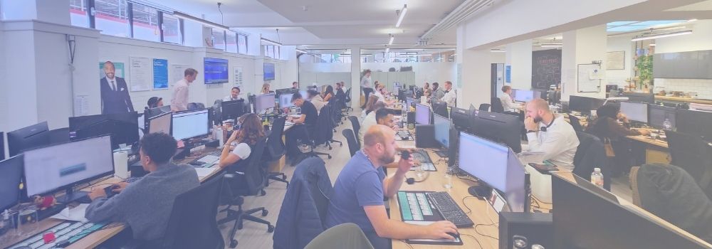 Busy open-plan office at Hunter Gatherer AHP headquarters in Shoreditch, London, showing recruitment consultants at work