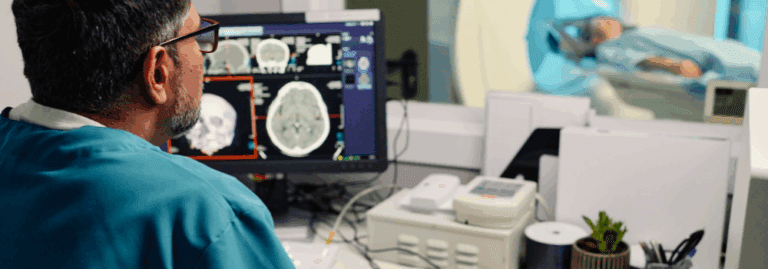 A radiographer placed by Hunter Gatherer AHP analysing brain MRI scans while a patient undergoes imaging, highlighting the impact of skilled locum AHPs in diagnostic care.