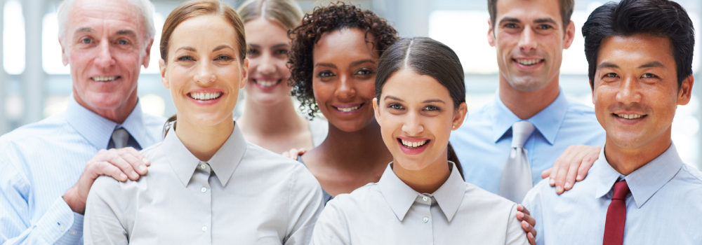 "Group of professional Allied Health locum staff smiling in a healthcare setting, representing Hunter Gatherer AHP's trusted locum network