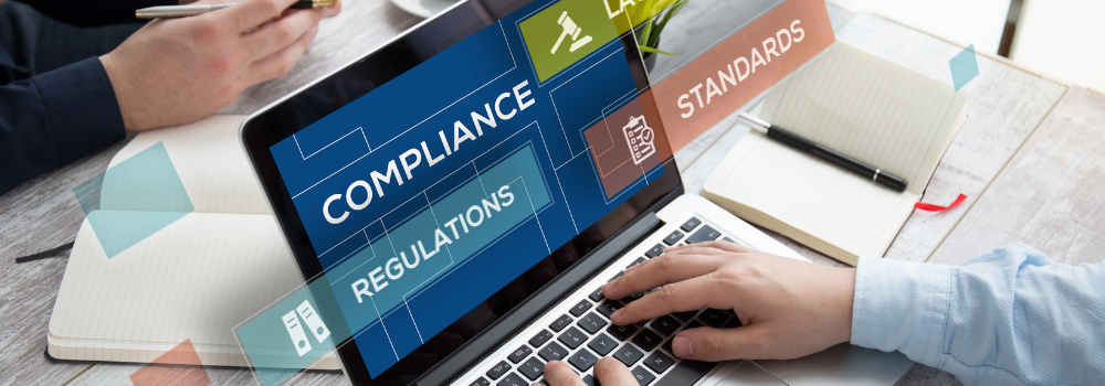 Healthcare recruitment compliance concept with laptop showing compliance, regulations and standards, highlighting the importance of safe staffing.