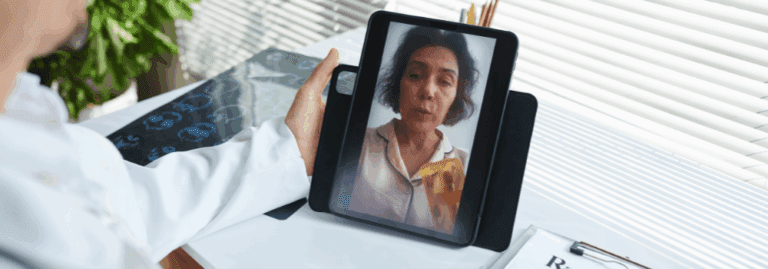 Doctor providing an online consultation with a patient via tablet