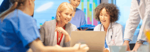 Healthcare professionals and managers discussing workforce planning in a hospital setting