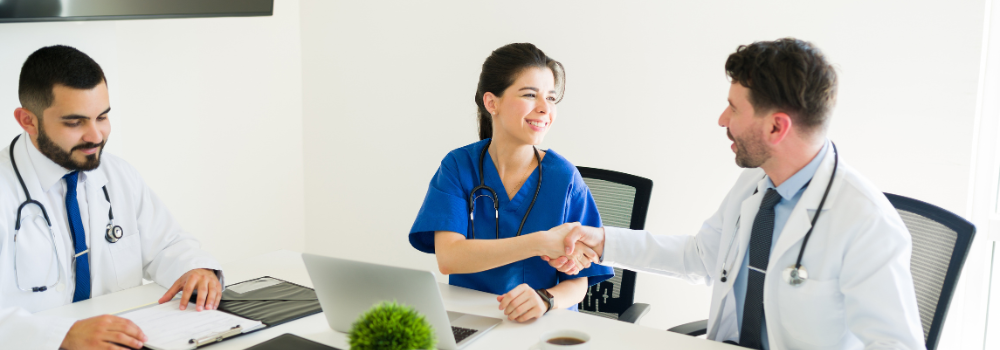 Allied Health professional discussing career progression and banding with NHS manager under Agenda for Change pay structure